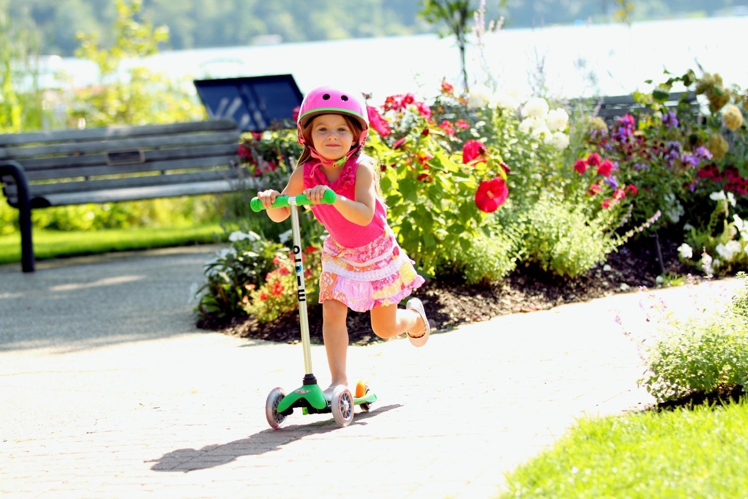 child riding scooter
